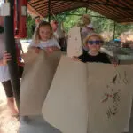 Kids with elephant dung recycled paper