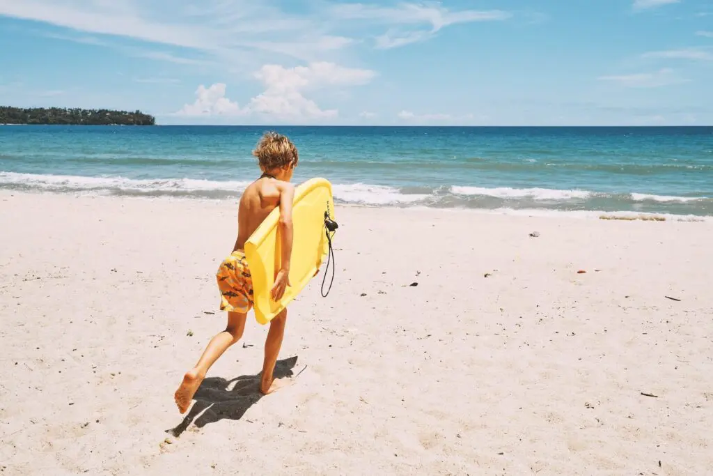 Little boy surfing in Phuket