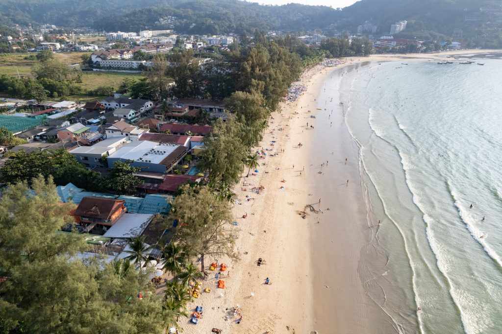 Aerial view of Kamala Beach in Phuket, surrounded by lush tropical vegetation