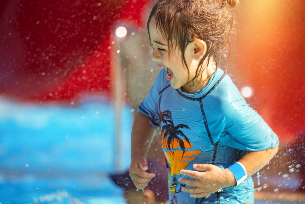 Cheerful Little Boy Having Fun in Waterpark on the Beach Resort.
